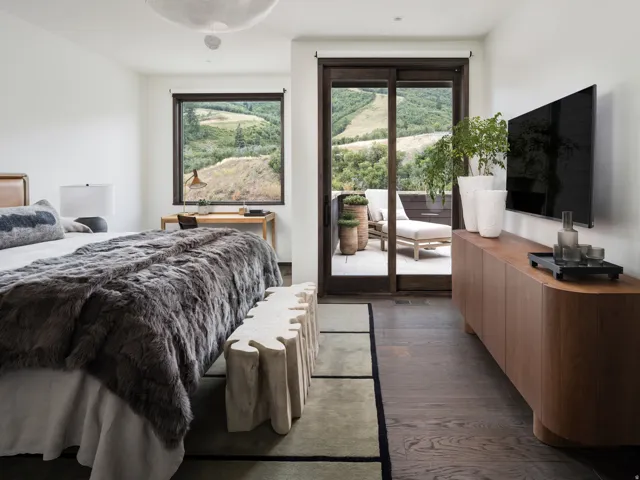 Dark wood-finish flooring complements a neutral color palette