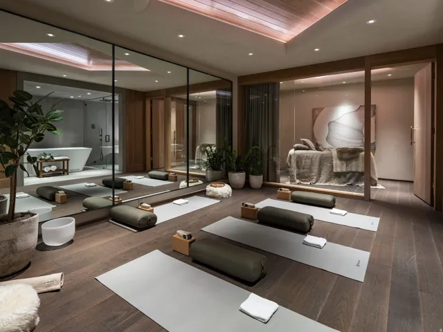 Spa-inspired interior with dark wood-finish flooring, recessed lighting, and a wood-paneled ceiling
