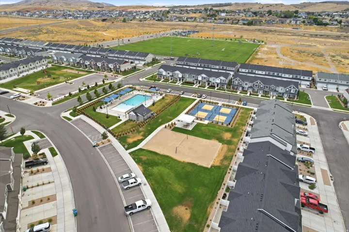 Community amenities featuring a swimming pool, multiple sports courts, volley ball and a park