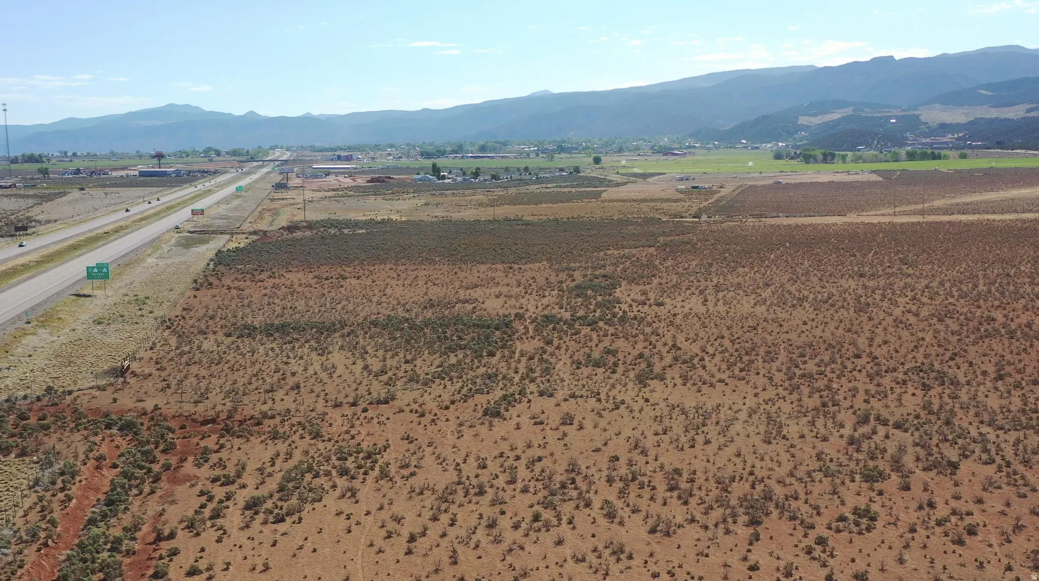 Expansive undeveloped land with desert vegetation