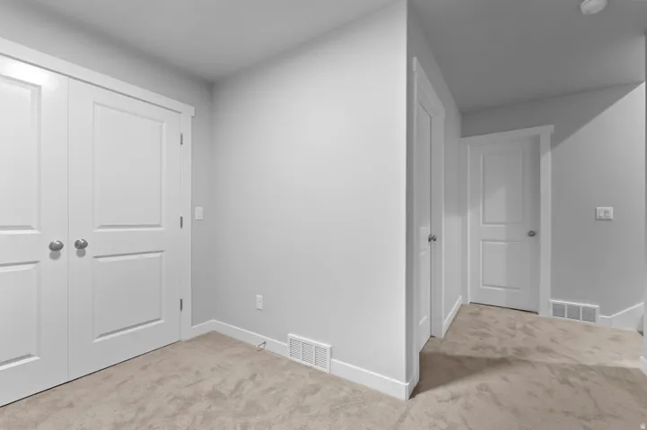 Neutral-toned carpeting throughout