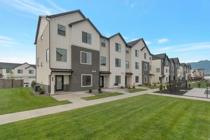 Modern townhome exterior featuring clean lines and a contemporary color palette