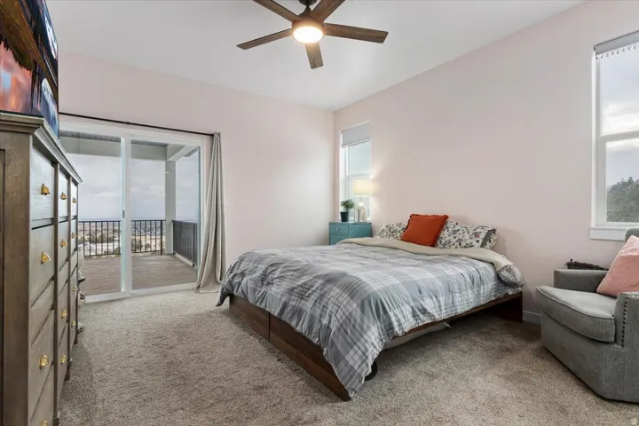 Bedroom featuring a private balcony with panoramic surroundings