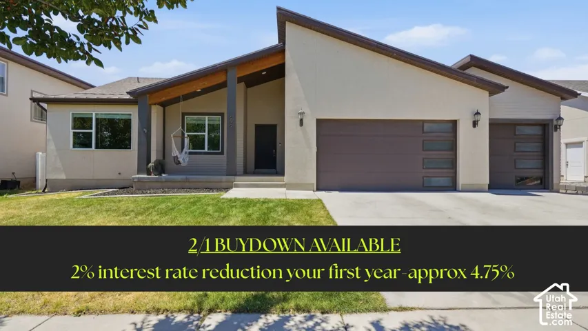 Contemporary exterior with a covered entry, dual garage doors featuring horizontal window panels, and a concrete driveway