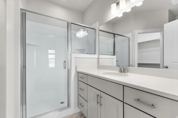 Walk-in shower with clear glass enclosure