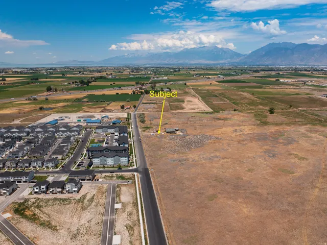 Expansive land parcel featuring direct road frontage and mountain backdrop
