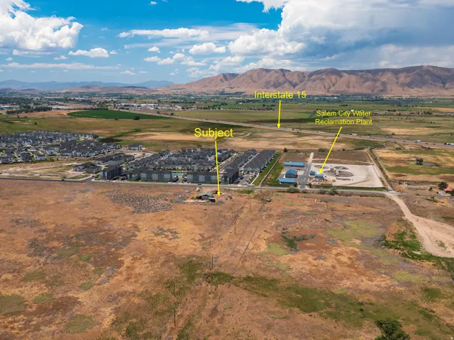 Expansive undeveloped land parcel with distant mountain backdrop