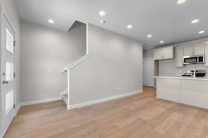 Light wood-finish flooring with recessed lighting