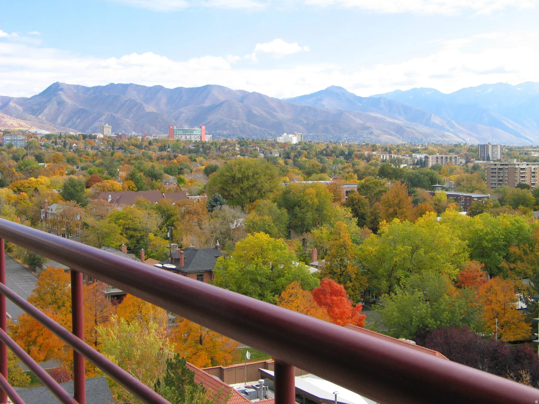 Expansive mountain range backdrop and city skyline