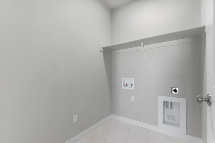 Built-in shelving, pre-plumbed connections, and light-toned flooring