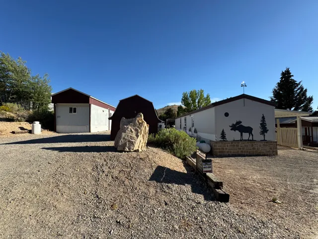 Gravel driveway providing access to multiple structures