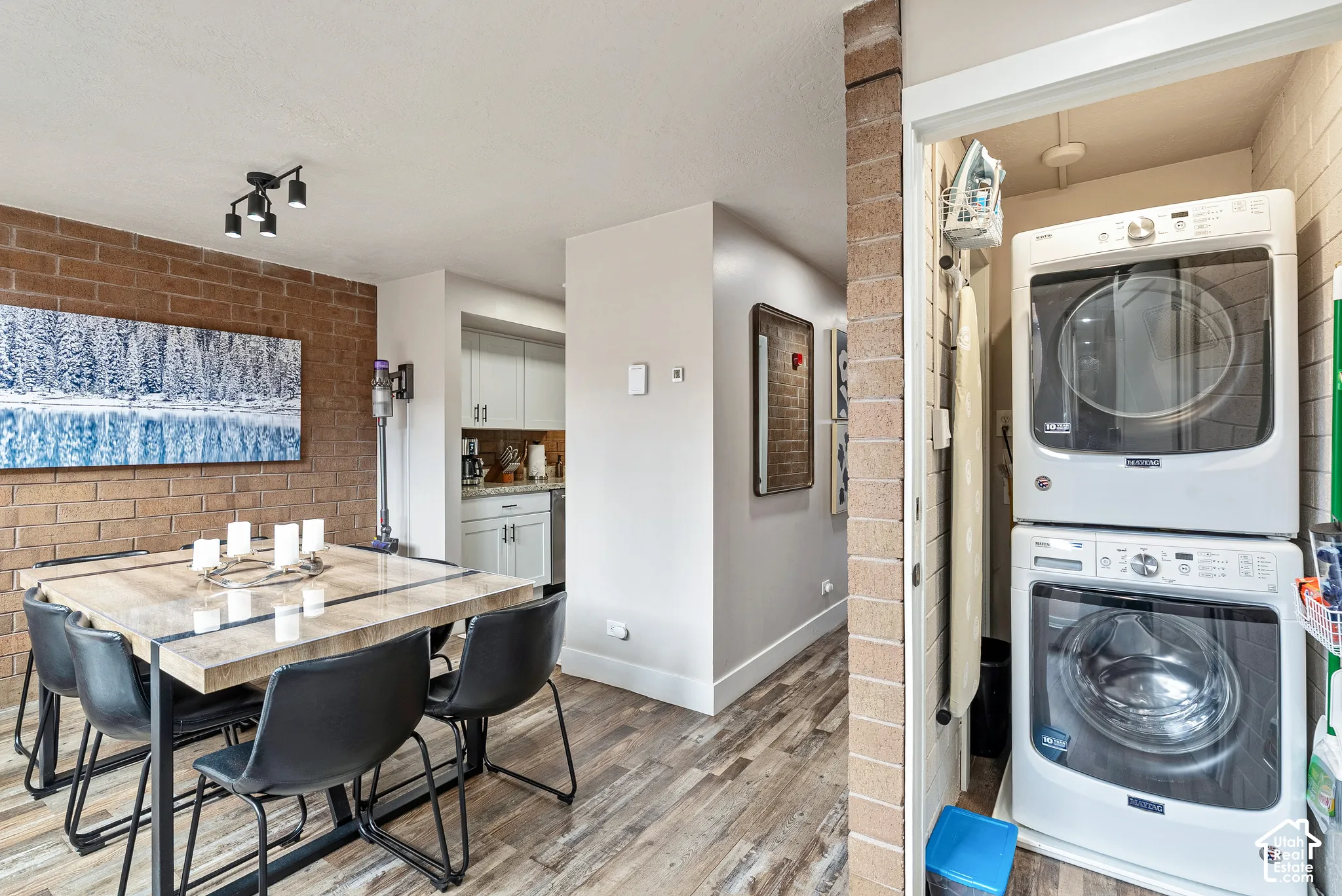 Dedicated laundry closet with stacked washer and dryer units