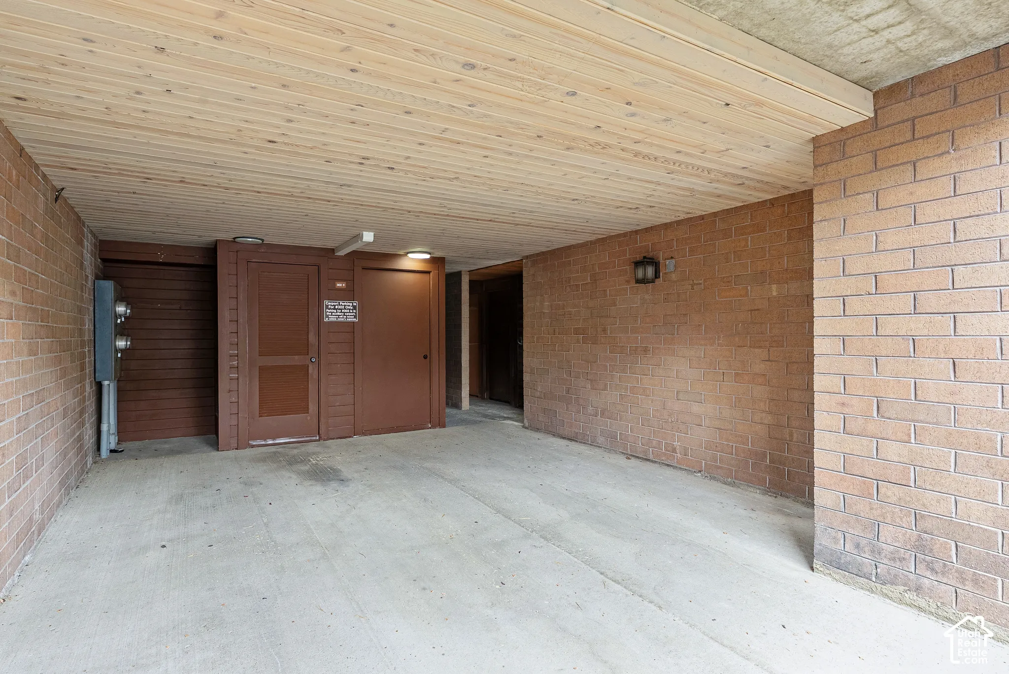 Concrete flooring with a wood-finish plank ceiling