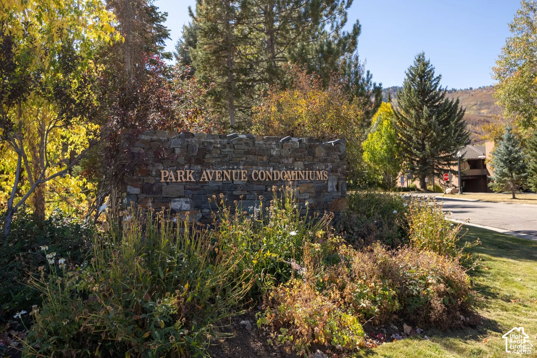 Stone-clad entry monument with raised lettering