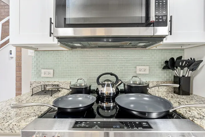 Built-in stainless steel microwave over a flat-top electric range