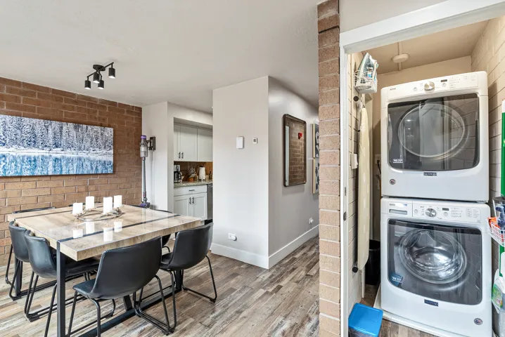 Dedicated laundry closet with stacked washer and dryer units