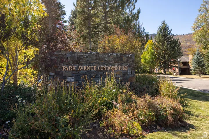 Stone-clad entry monument with raised lettering