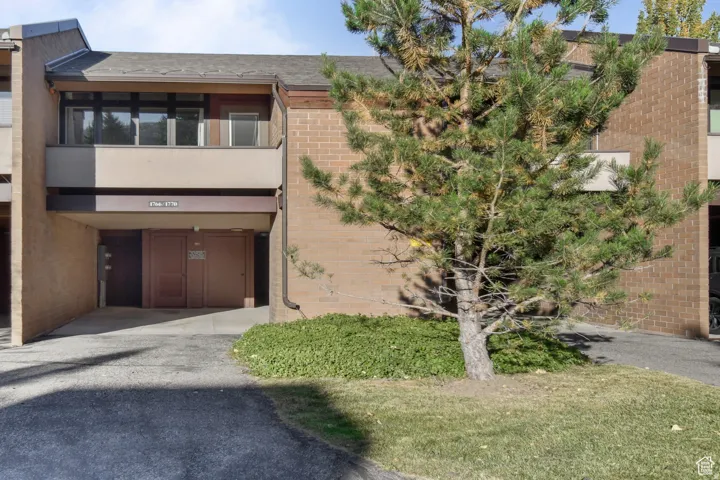 Brick and panel exterior with a prominent balcony