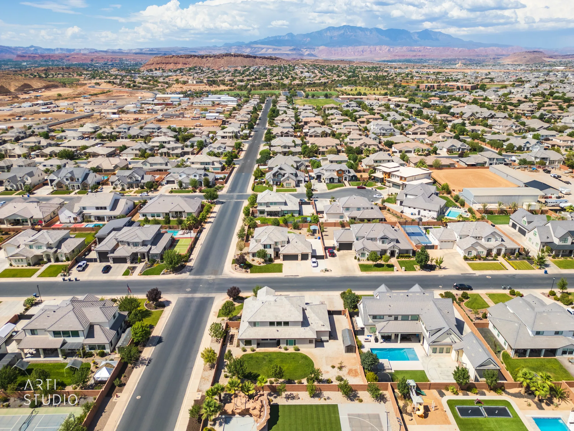 Expansive aerial perspective showcasing a residential neighborhood with numerous single-family homes