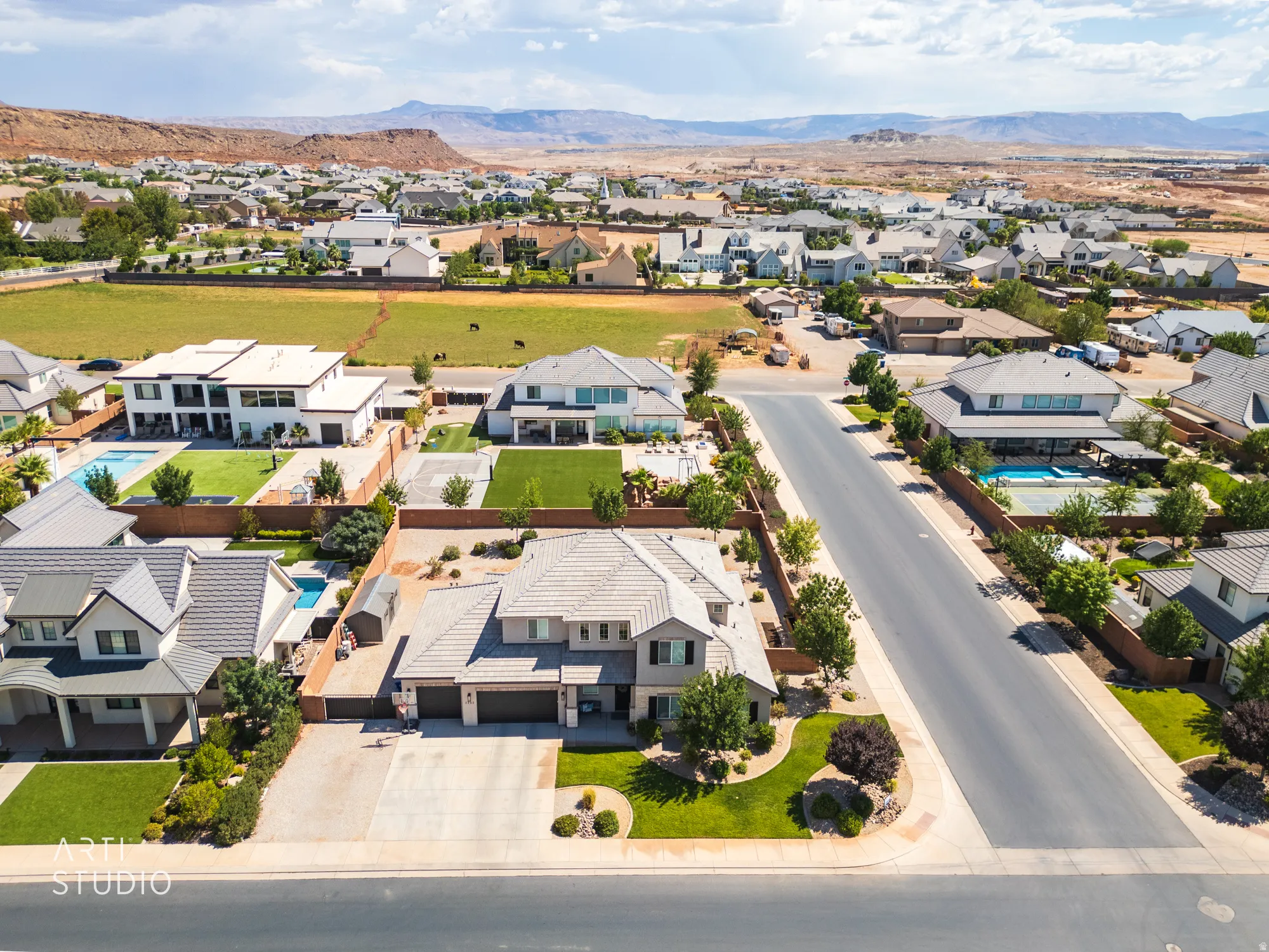 Suburban neighborhood with mature landscaping, paved streets, and a variety of architectural styles