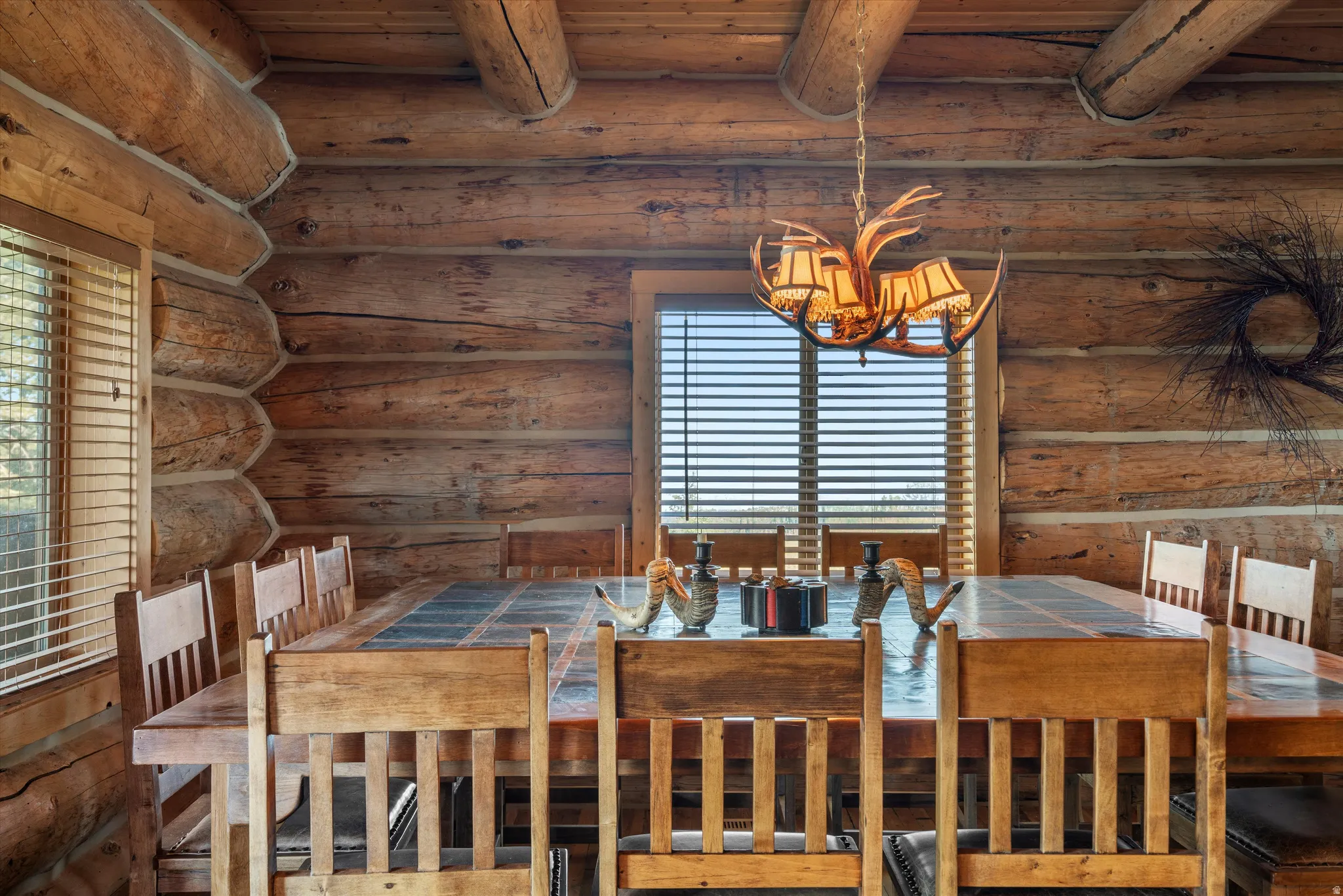 Log cabin interior featuring exposed wood beams and log walls