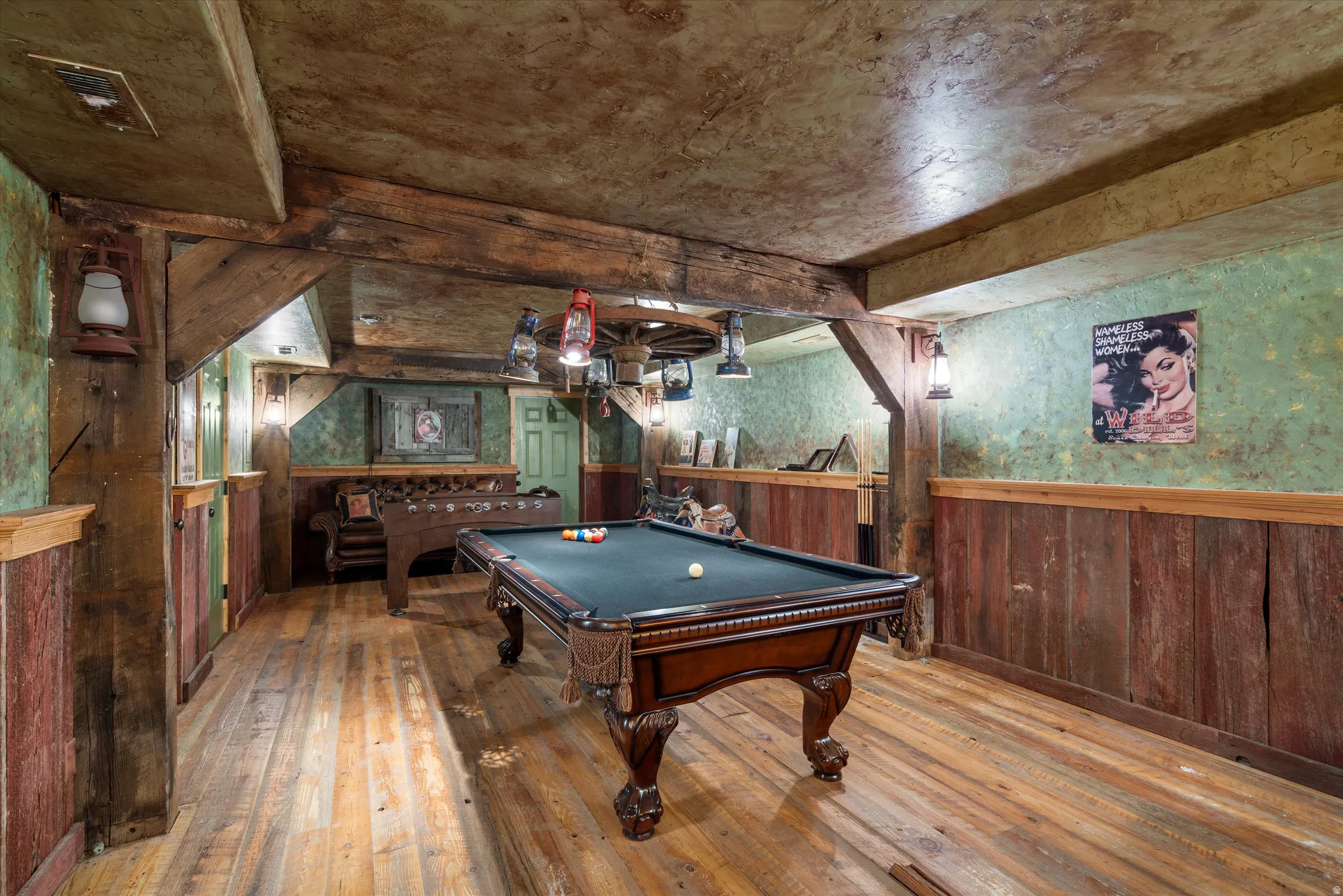 Reclaimed wood-finish flooring with exposed ceiling beams