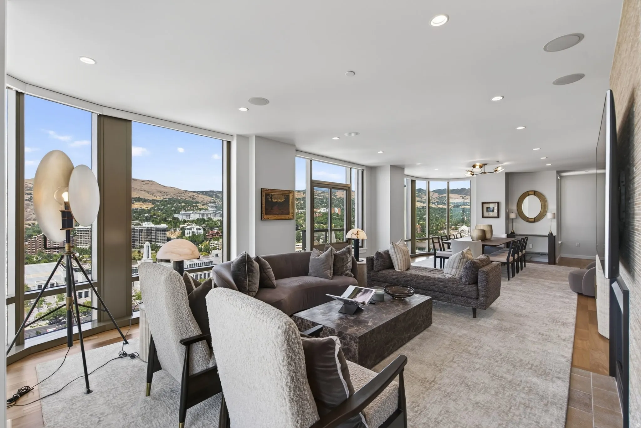 Open-concept living area with extensive floor-to-ceiling windows