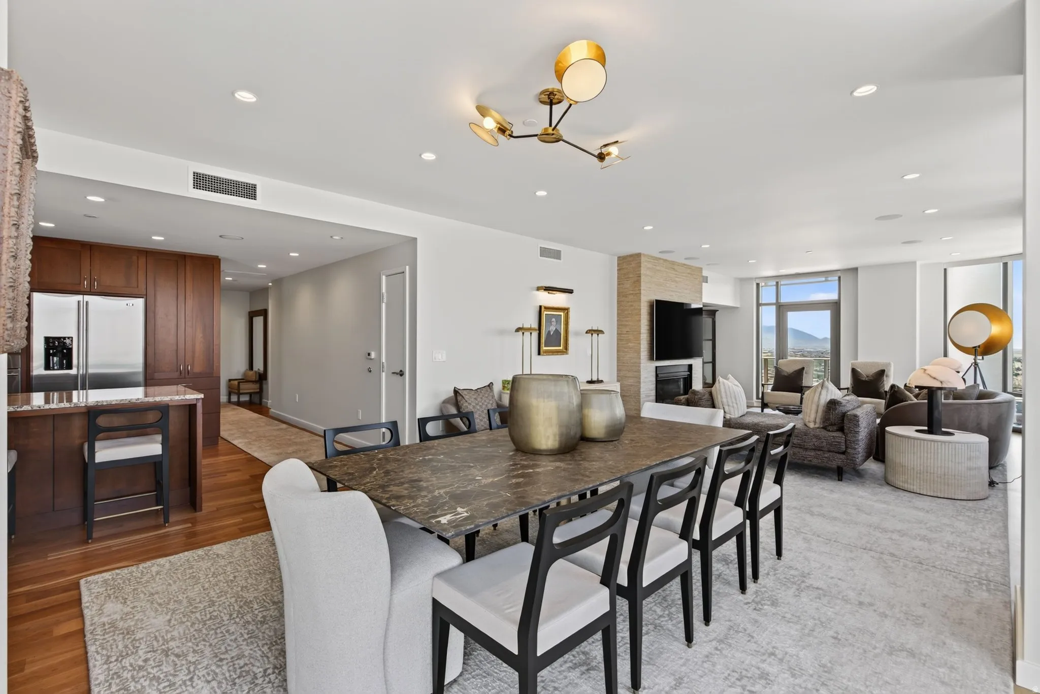 Expansive open-concept living space featuring a dining area, kitchen, and living room