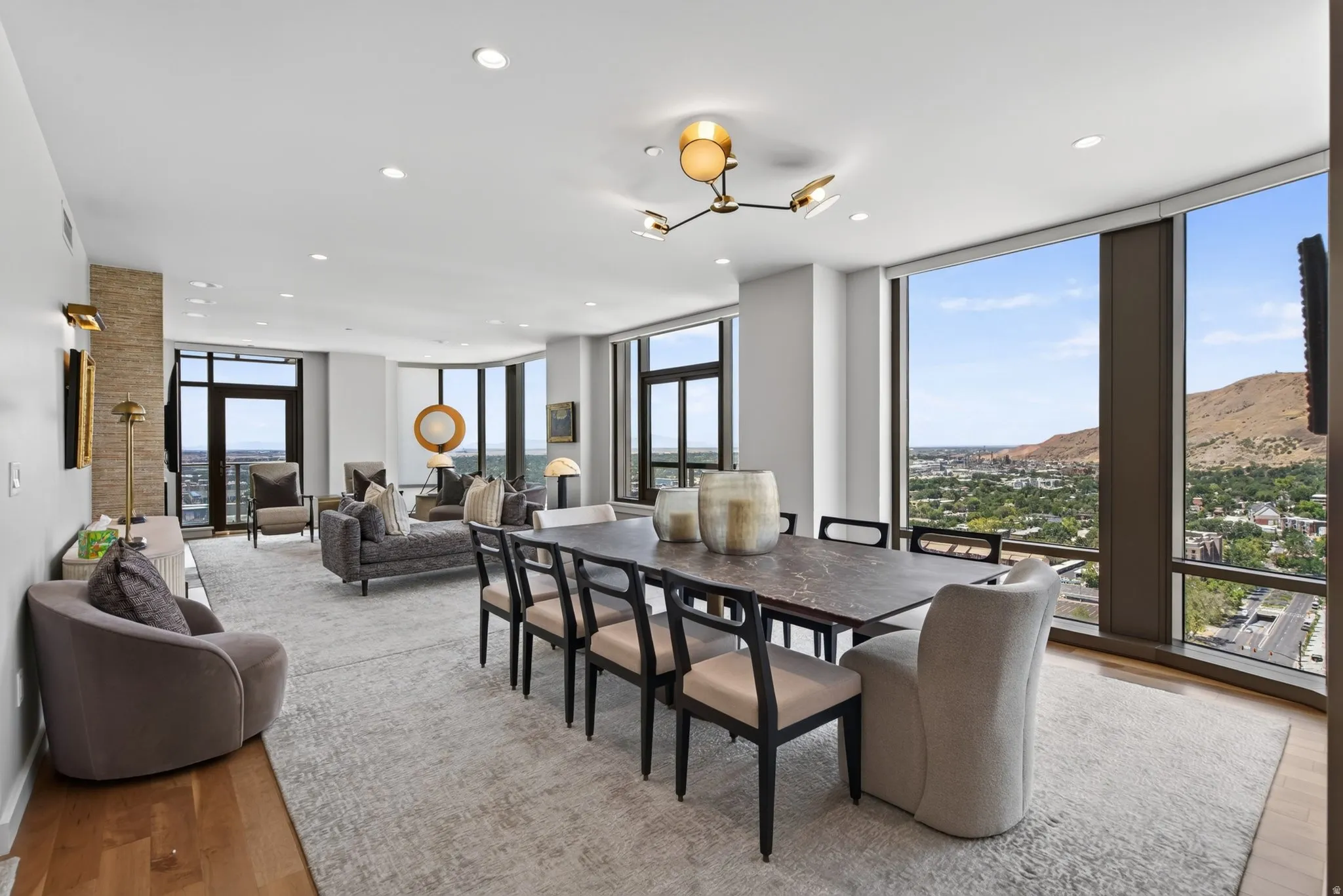 Open-concept living area with expansive floor-to-ceiling windows