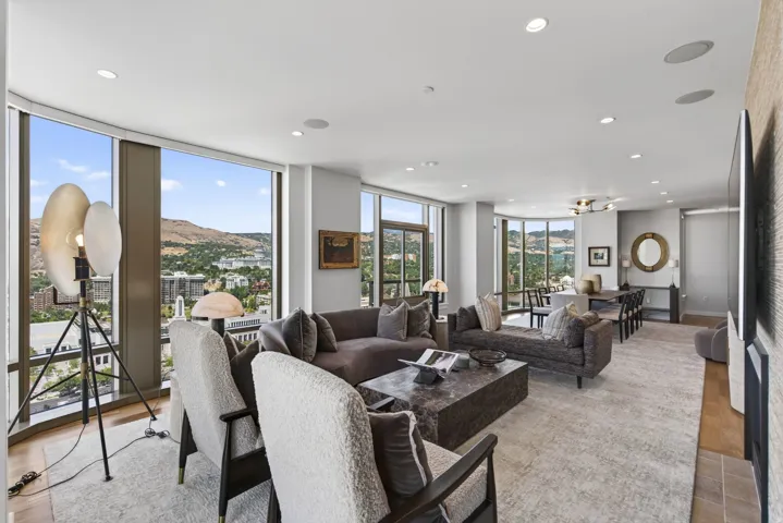 Open-concept living area with extensive floor-to-ceiling windows