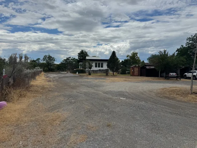Gravel driveway providing access to the property