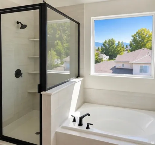 Tiled shower enclosure with a glass panel and built-in shelving