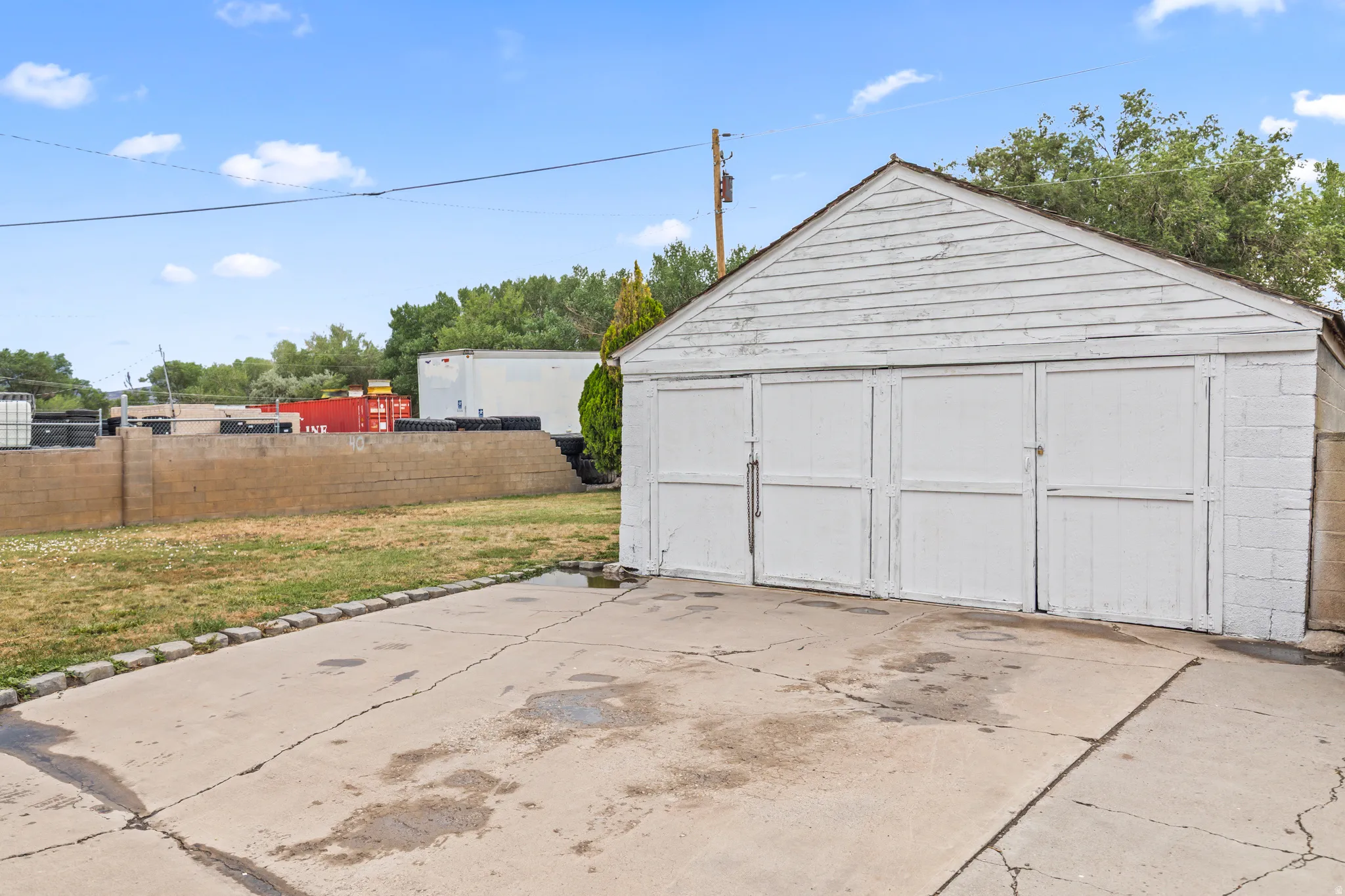 Detached two-stall garage with a gabled roof and horizontal siding