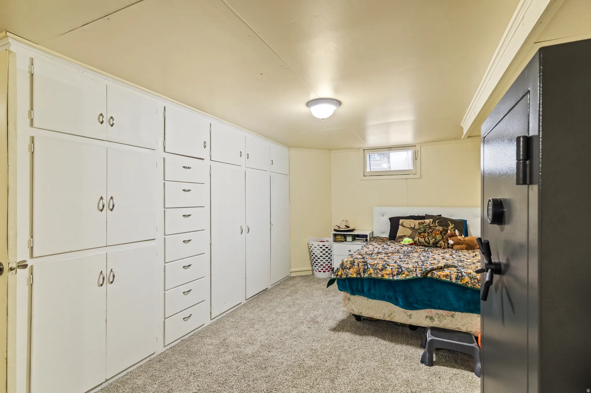 Extensive built-in white cabinetry and drawers providing ample storage