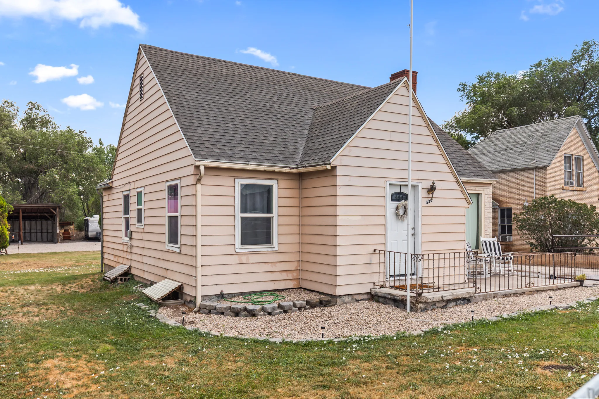 Gable-roof property featuring horizontal siding and a covered front entry