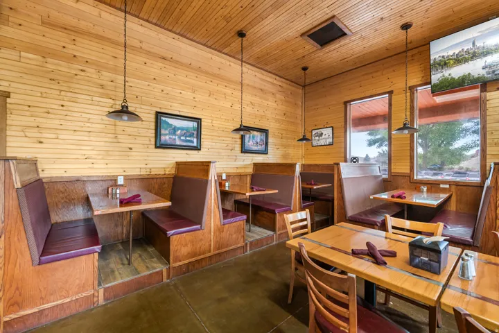 Warm wood-paneled walls and ceiling