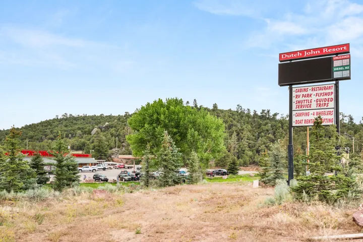 Resort signage featuring a digital display and listed amenities