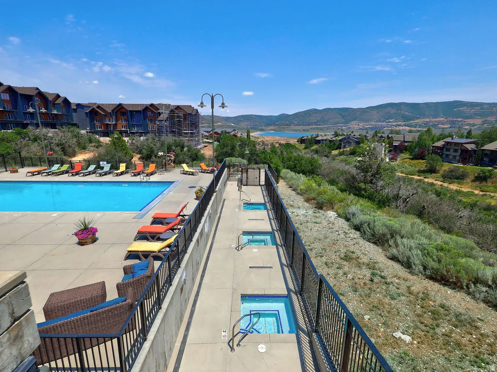Large swimming pool and multiple hot tubs,