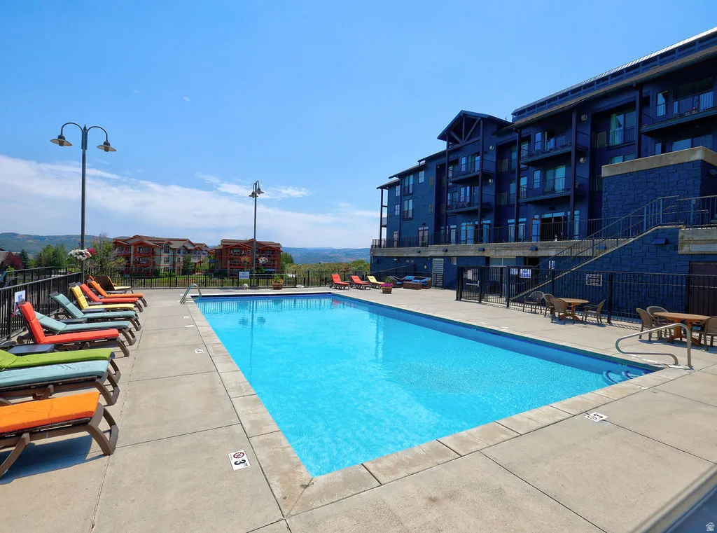 Huge outdoor swimming pool and hot tubs beyond