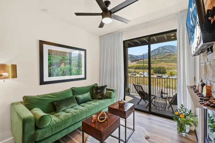 Cozy up and enjoy the ski slope views in this bright , natural light living area with gas fireplace. Glass doors open to a spacious balcony with stunning mountain scenery