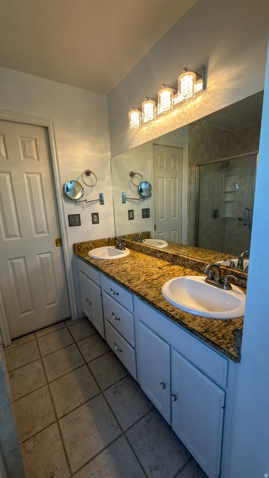 Master Bath, dual vanity featuring white cabinetry, a speckled countertop, and two integrated sinks