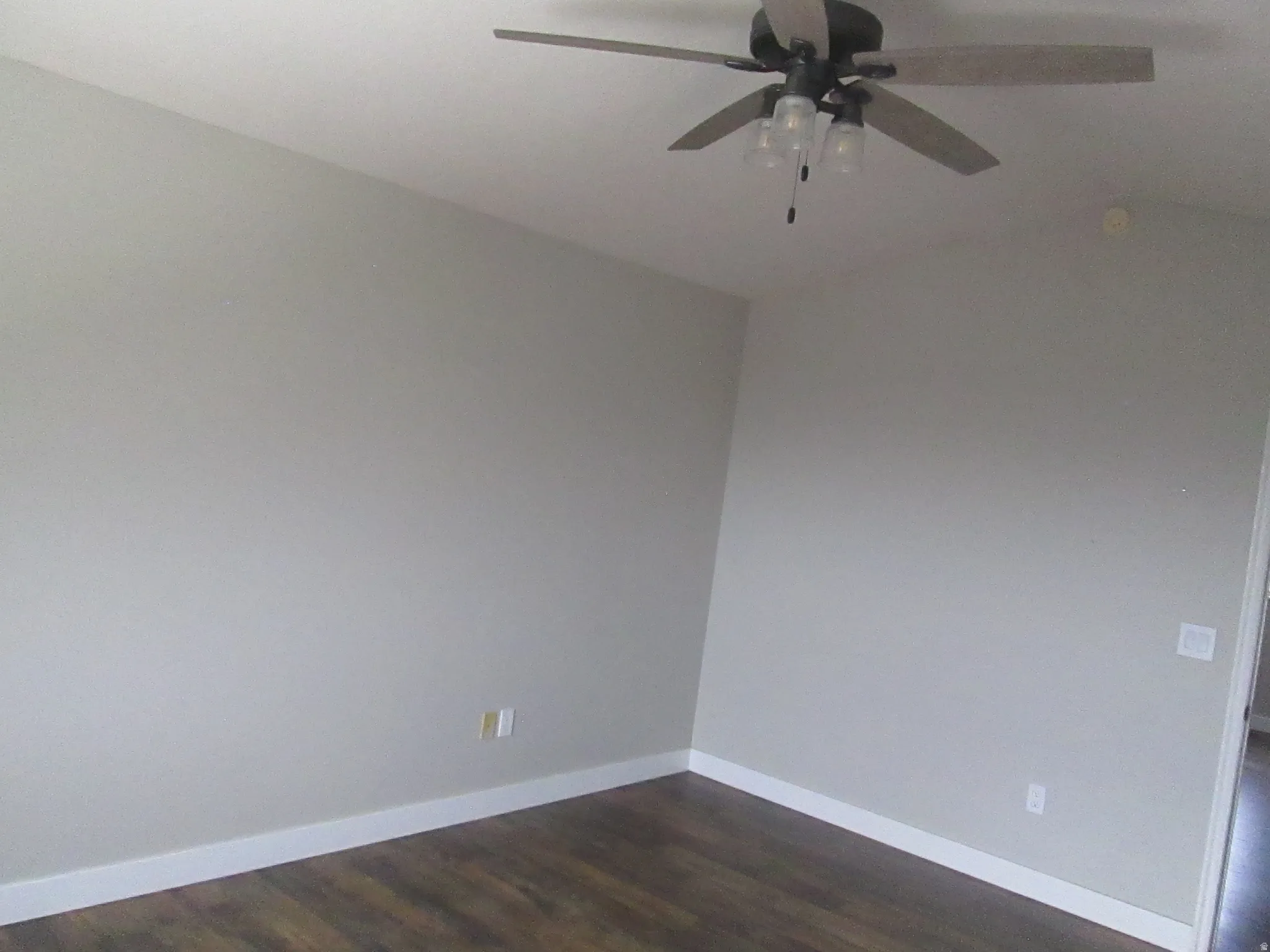 Master Bedroom, neutral-toned walls, wood-finish flooring, and a ceiling fan with integrated lighting