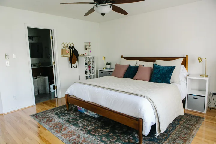 Bright bedroom featuring wood flooring and a ceiling fan