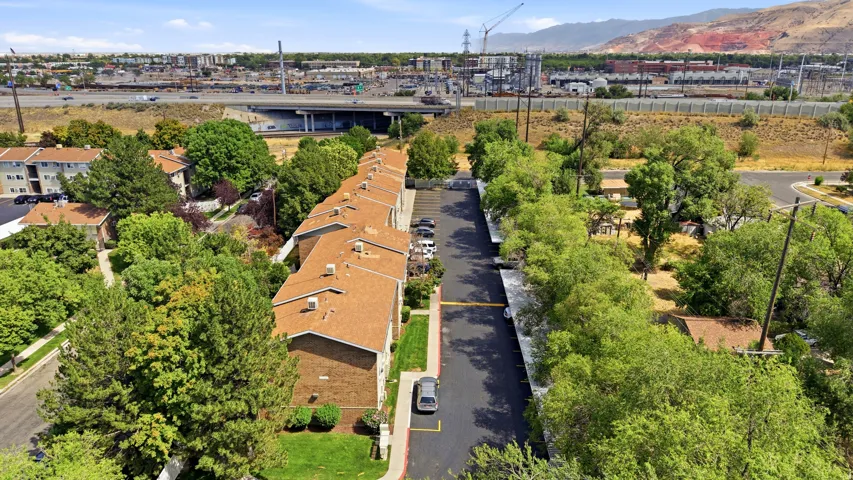 Apartment complex featuring brick facades and brown shingle roofs