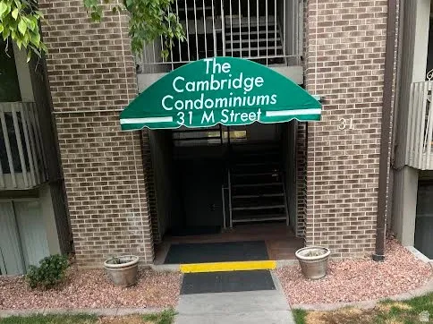 Brick facade with a green fabric awning