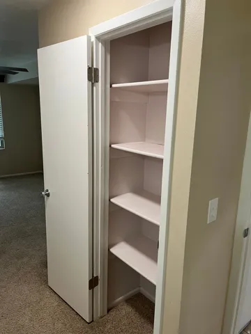 Built-in shelving unit with multiple storage levels