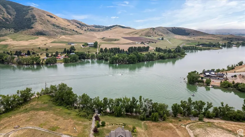 Expansive water body surrounded by natural landscapes