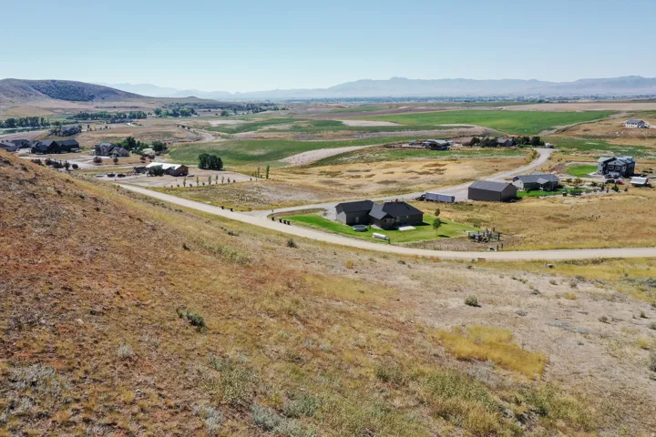 Expansive land parcel featuring natural topography and varied vegetation