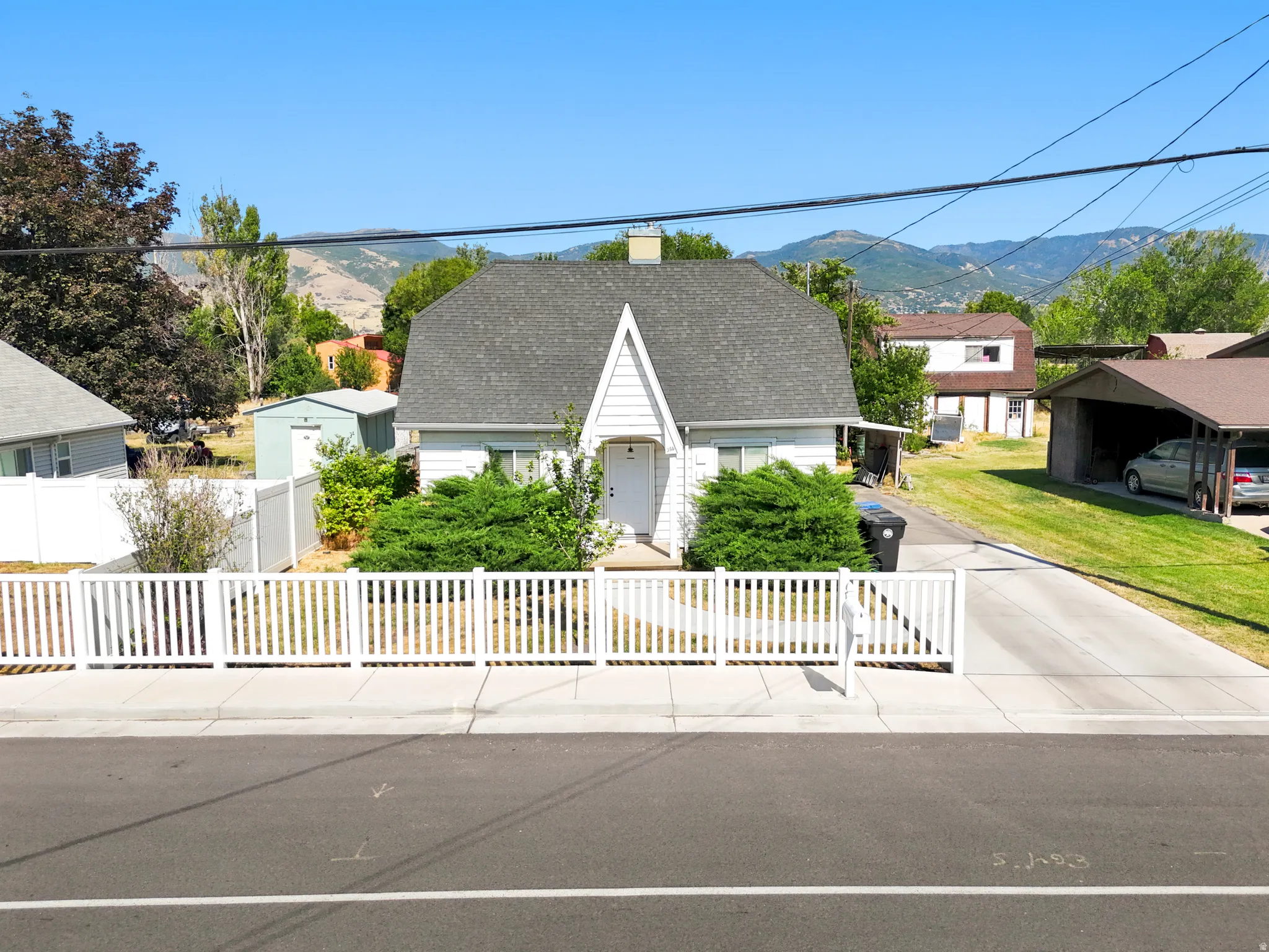 White exterior with a prominent A-frame entrance
