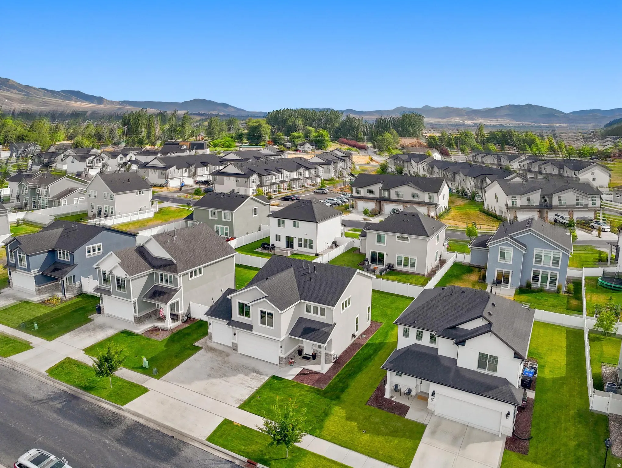 Aerial overview of a residential neighborhood with varied contemporary-style homes